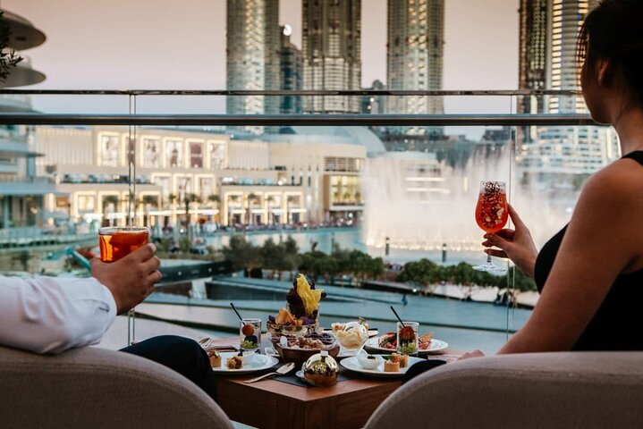 Savor exquisite Mediterranean flavors while enjoying stunning views of Dubai's iconic skyline and the mesmerizing fountain show creating unforgettable moments in an elegant setting.